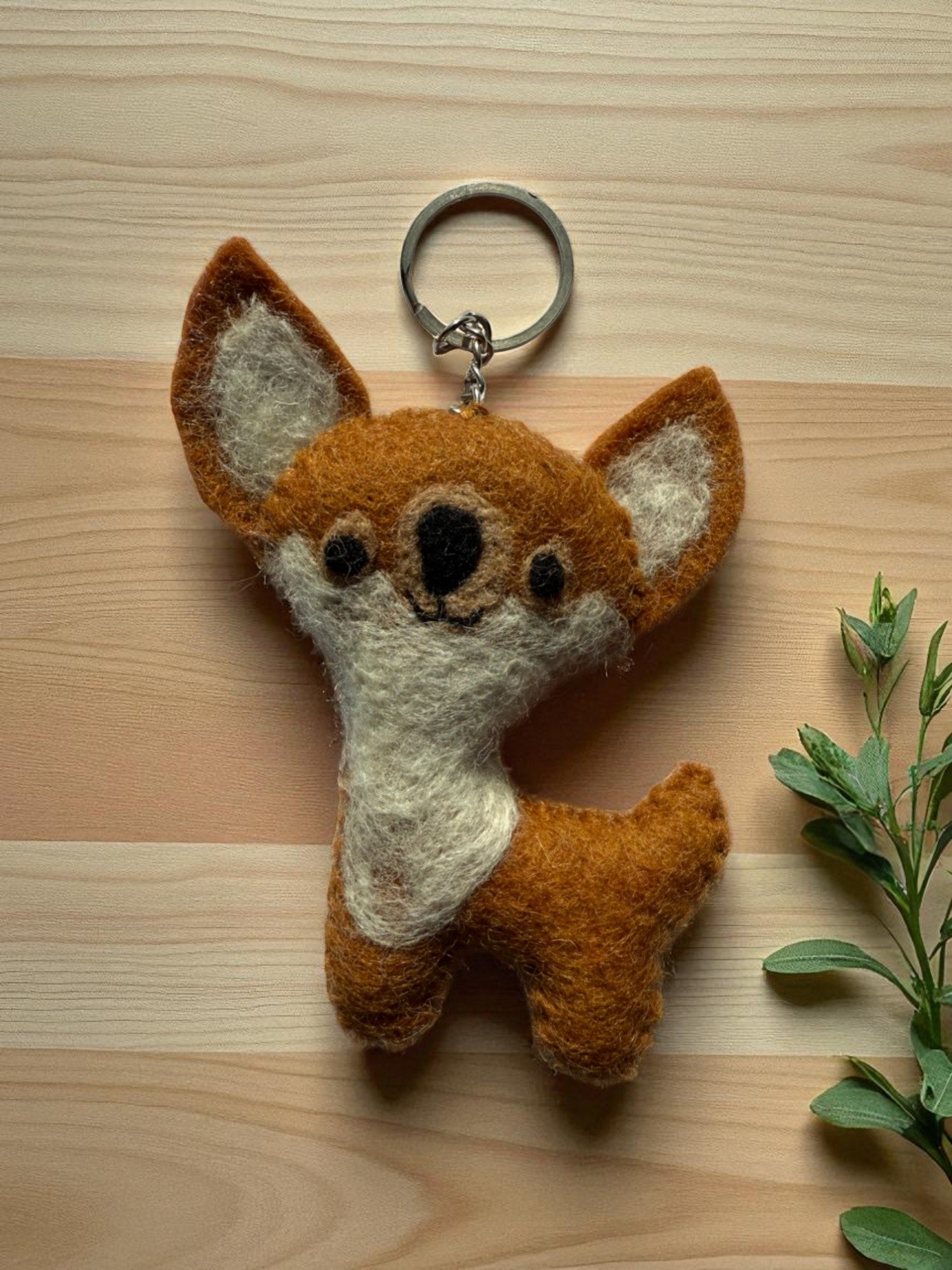 Handmade felt keychain featuring a fox by artisans in Nepal, fair trade and eco-friendly