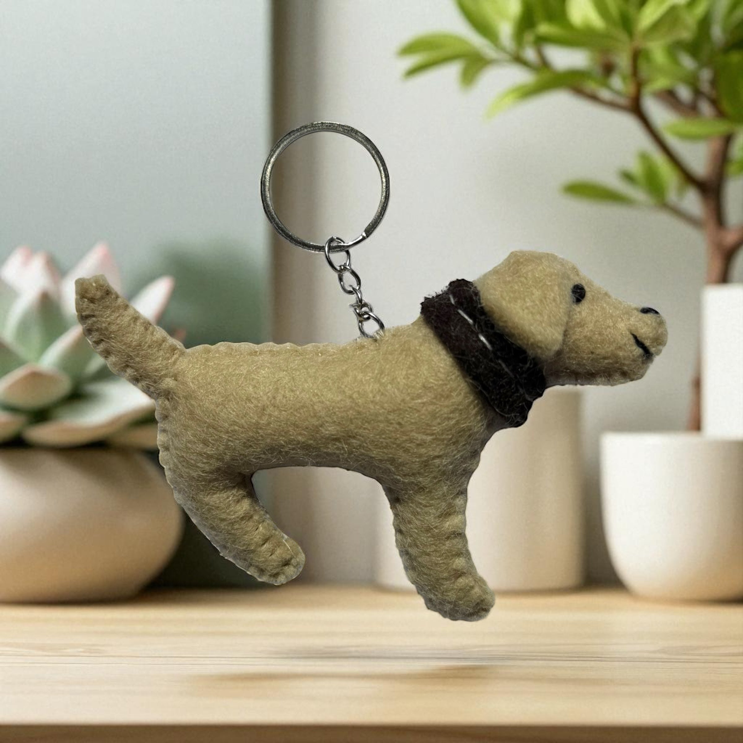 Handmade felt keychain featuring a brown labrador with a brown collar crafted by artisans in Nepal, fair trade and eco-friendly