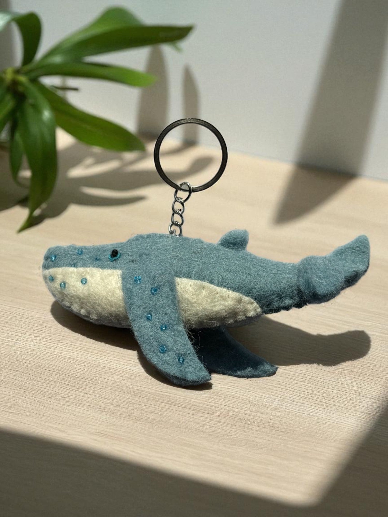 Handmade felt keychain featuring a whale by artisans in Nepal, fair trade and eco-friendly