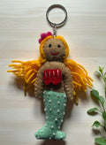 Handmade felt keychain featuring a blonde mermaid by artisans in Nepal, fair trade and eco-friendly
