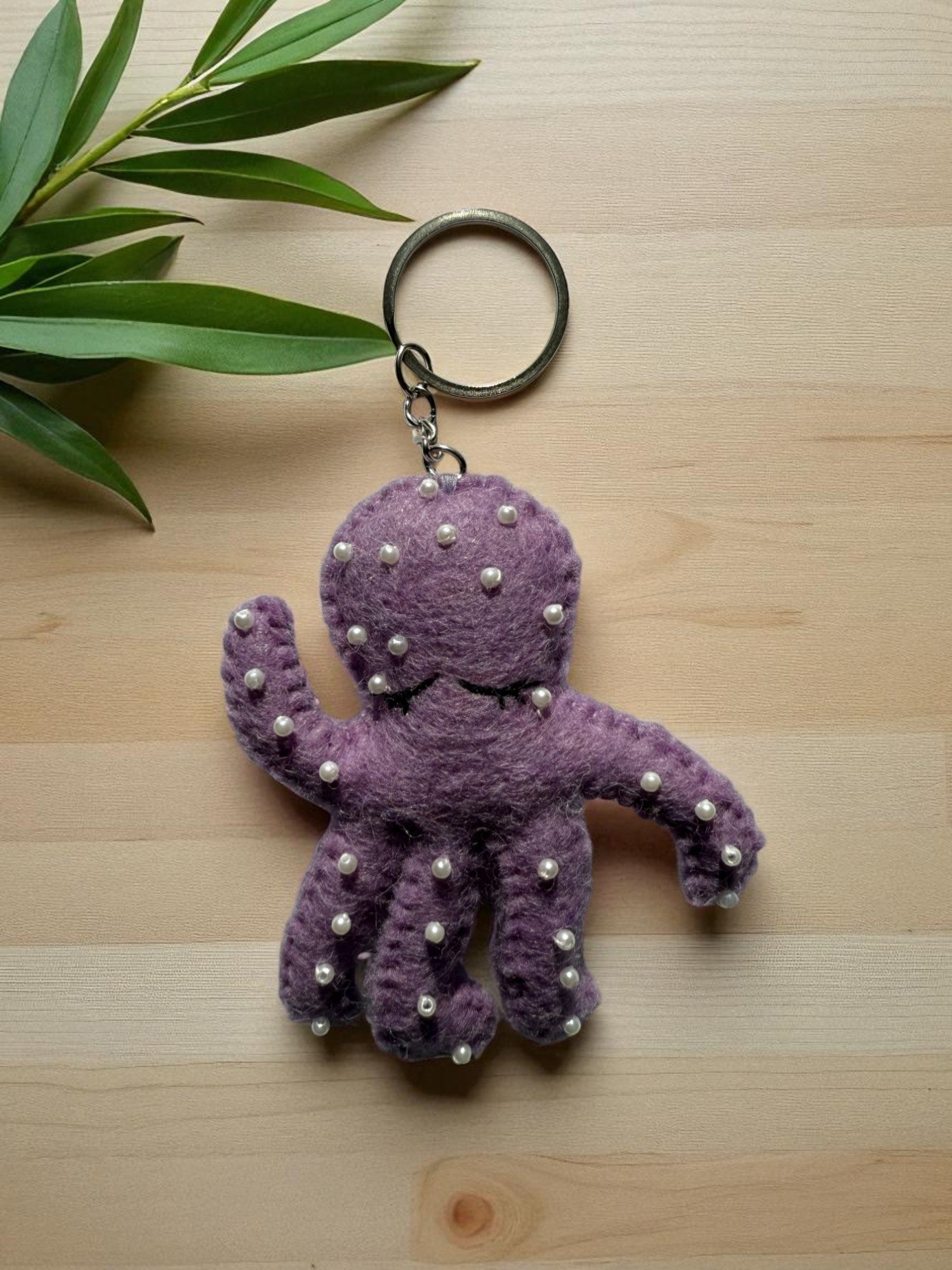 Handmade felt keychain featuring a carrot by artisans in Nepal, fair trade and eco-friendly