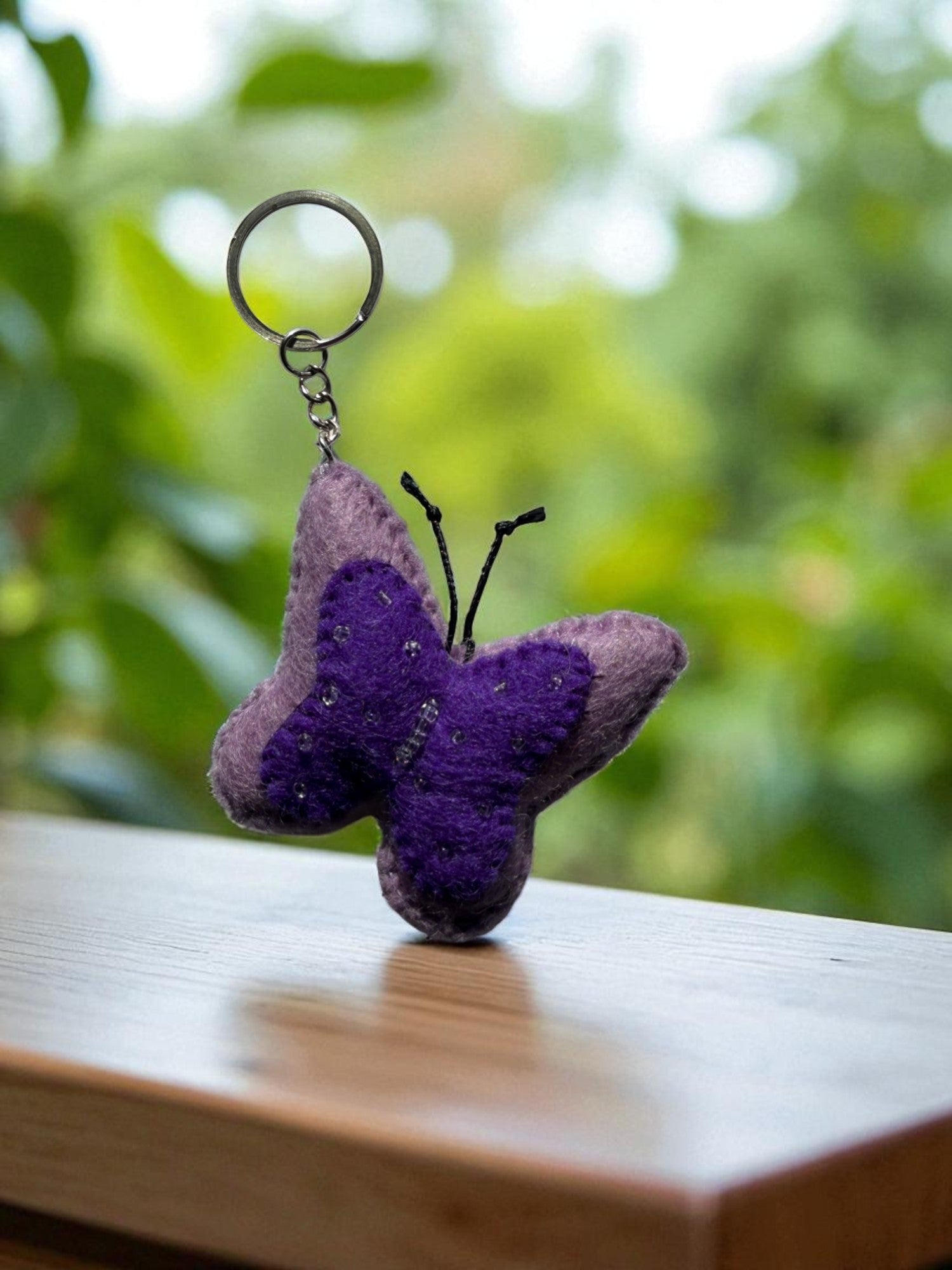 Handmade felt keychain featuring a butterfly by artisans in Nepal, fair trade and eco-friendly