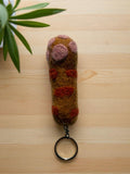 Handmade felt keychain featuring a carrot by artisans in Nepal, fair trade and eco-friendly