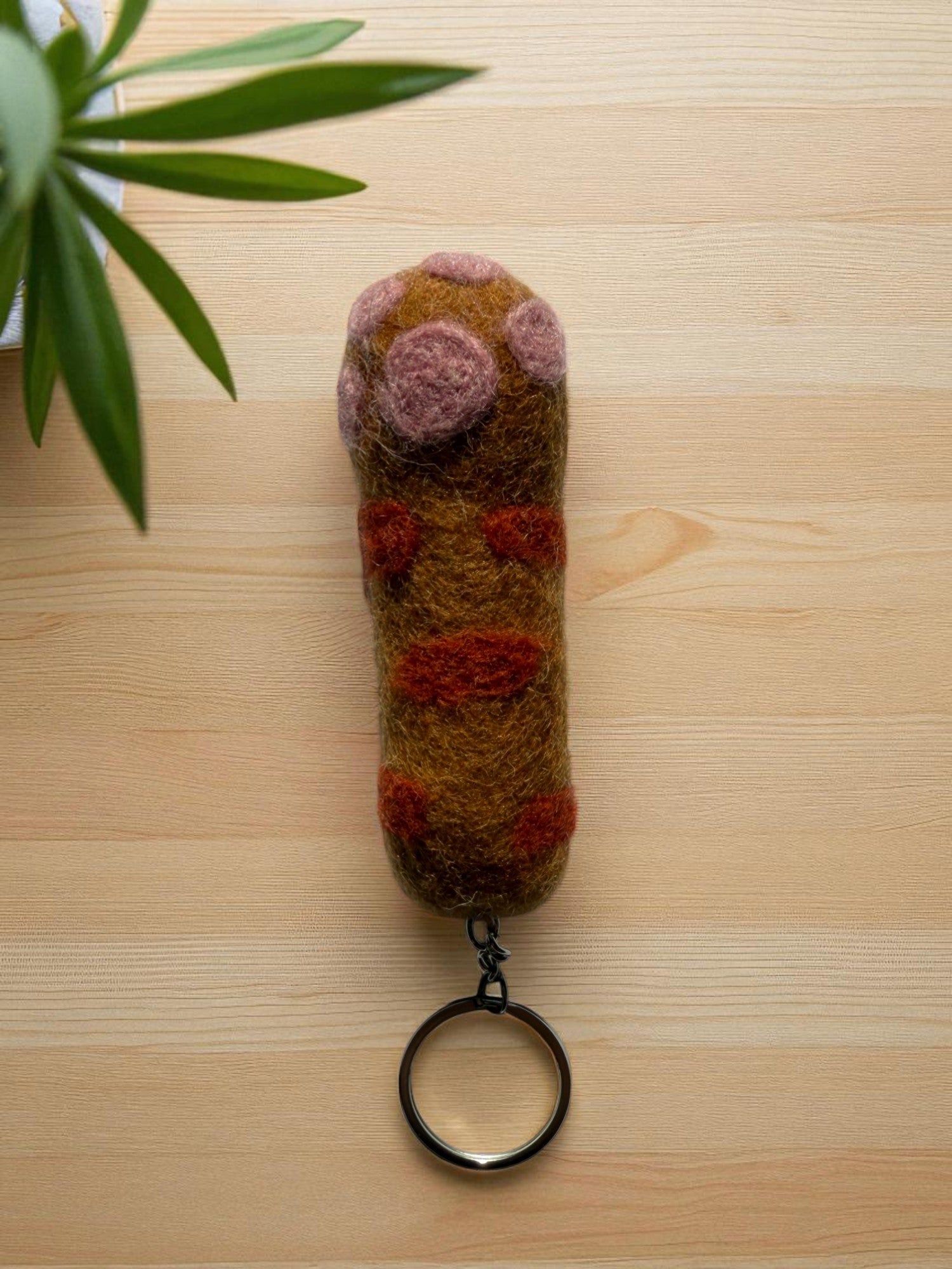Handmade felt keychain featuring a carrot by artisans in Nepal, fair trade and eco-friendly