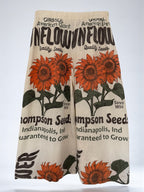 wide leg Pants with sunflower design and thompson seeds text