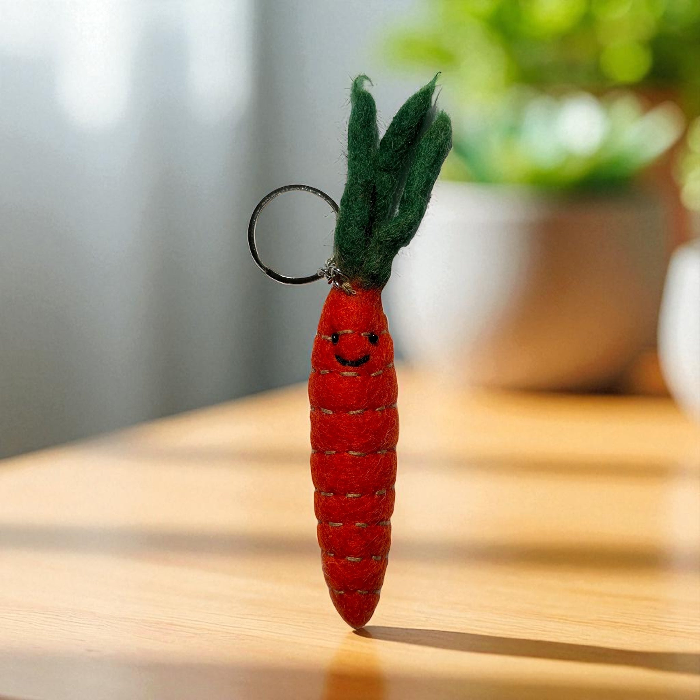 Handmade felt keychain featuring a carrot by artisans in Nepal, fair trade and eco-friendly