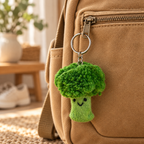 Handmade felt Broccoli keychain displayed on a bag