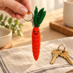 Handmade felt Carrot keychain shown in a lifestyle setting
