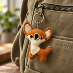Handmade felt Fox keychain displayed on a bag