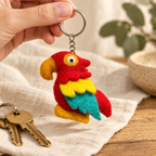 Handmade felt Parrot keychain shown in a lifestyle setting