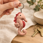 Handmade felt Seahorse keychain shown in a lifestyle setting
