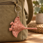 Handmade felt Stingray keychain displayed on a bag