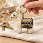 Handmade felt White Brown Llama keychain shown in a lifestyle setting